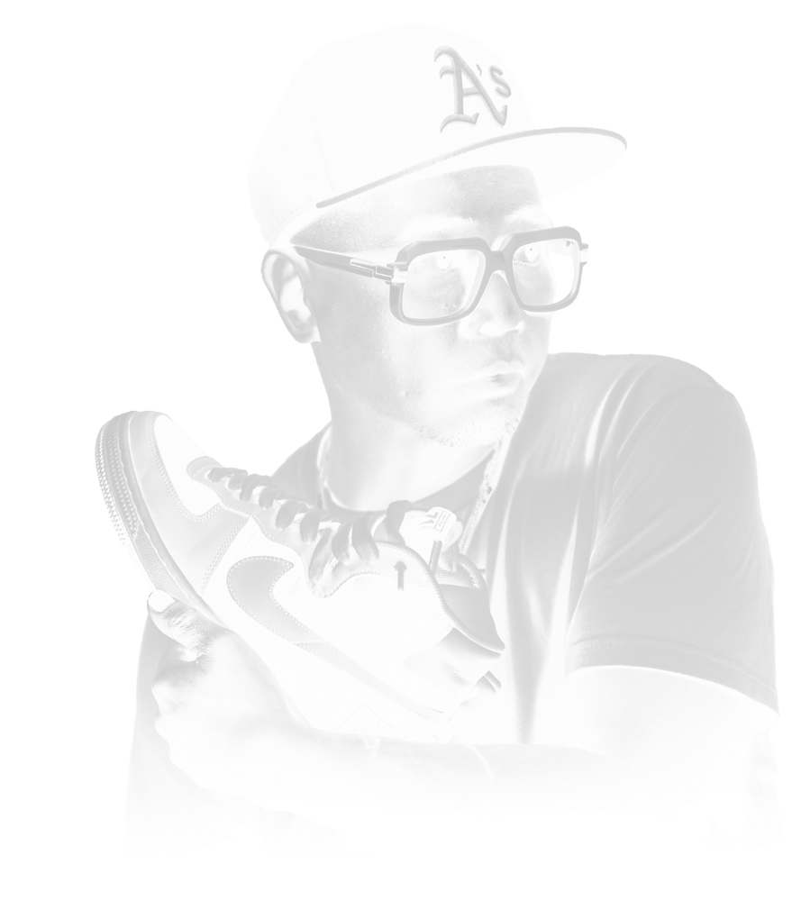 L Dante Guarin in an A's cap and white-framed glasses, holding up a sneaker.